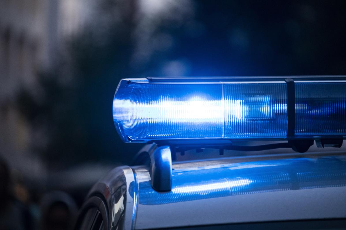 A close up of a police car with its lights on photo