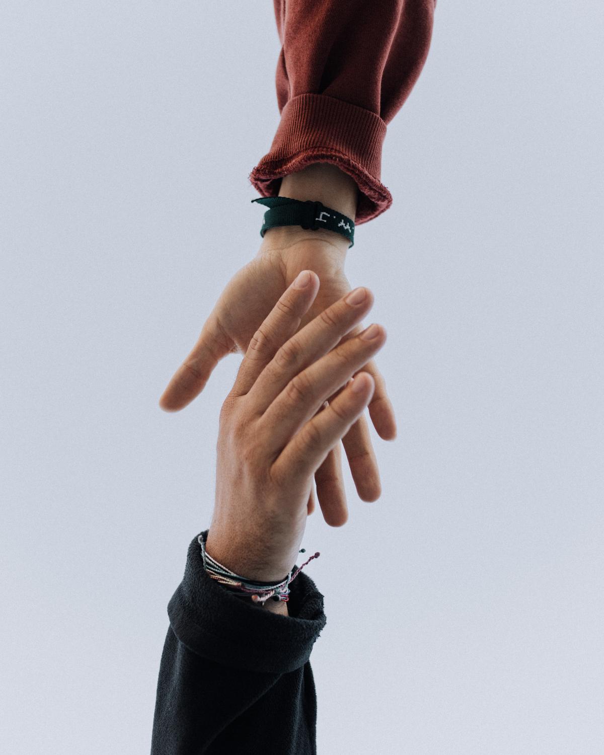 View of two persons hands photo